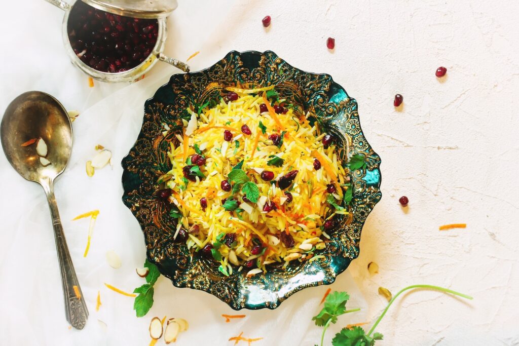 Bowl of rice with jewels of pomegranate seeds, one of the most-requested vegetarian holiday recipes.