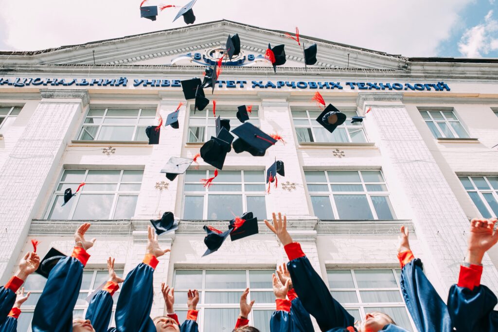 graduation caps in the air 