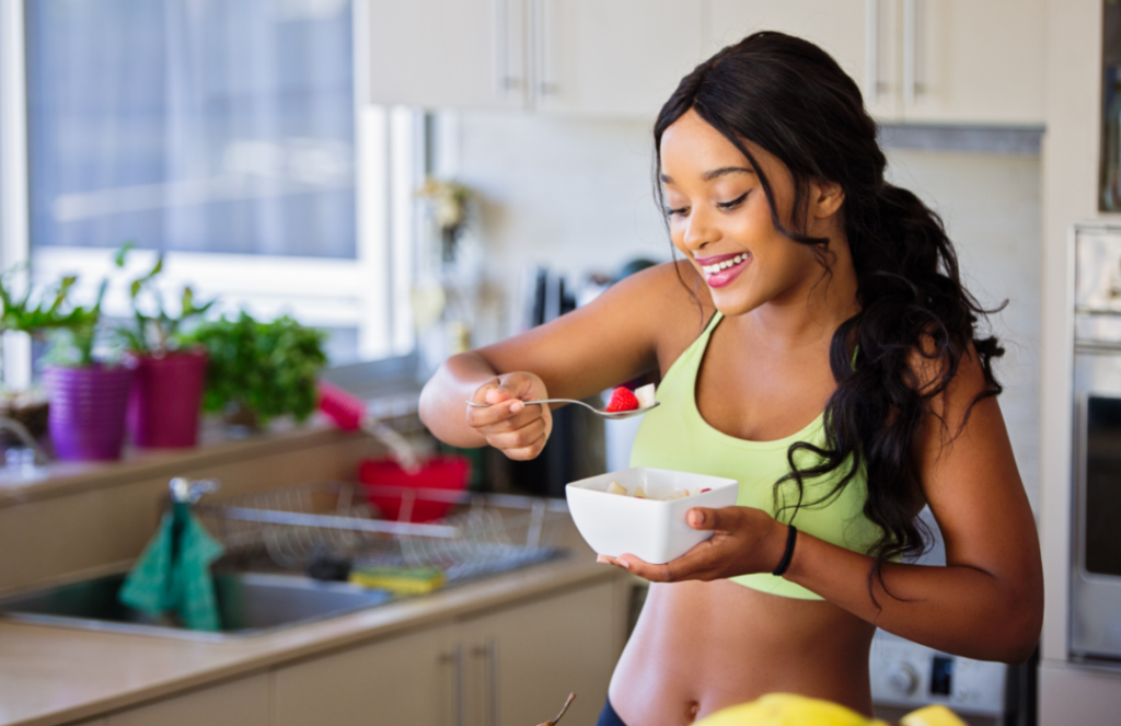 Fit woman eating fruits