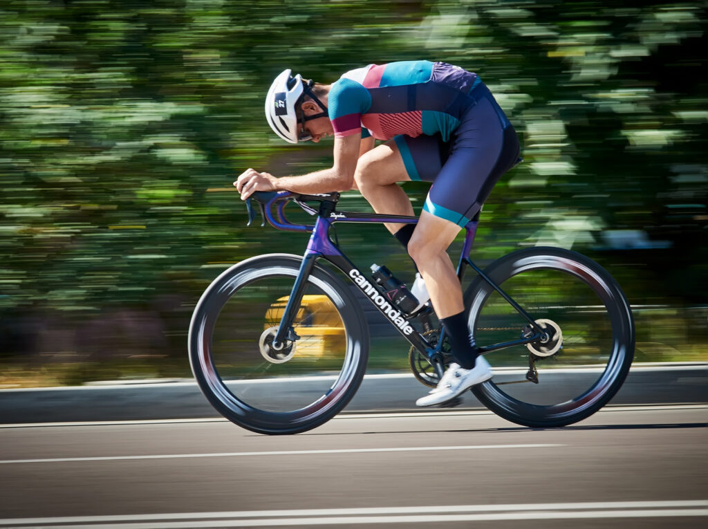 Cyclist riding black road bike