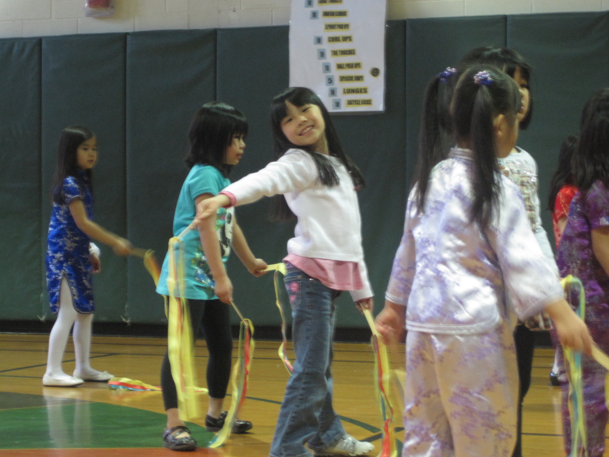 Chinese adoptee plays with ribbons