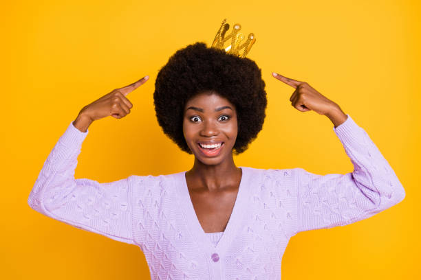 woman with a crown on her natural hair