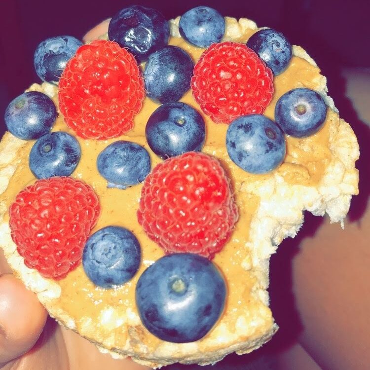 Rice cake with peanut butter and berries