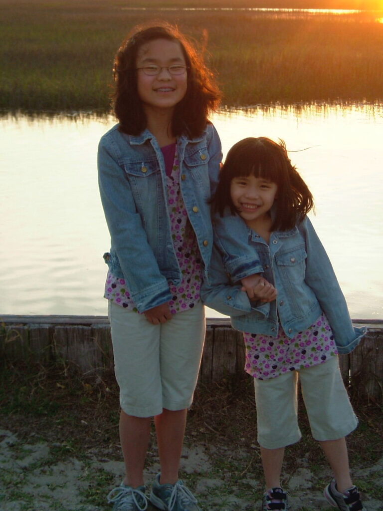 Sisters adopted from China smiling