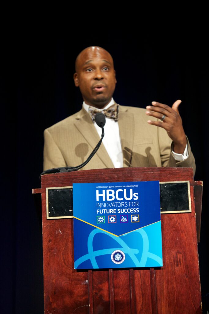 Dr. Bryant T. Marks speaks at podium and supports HBCUs at 2014 HBCU National Conference.
