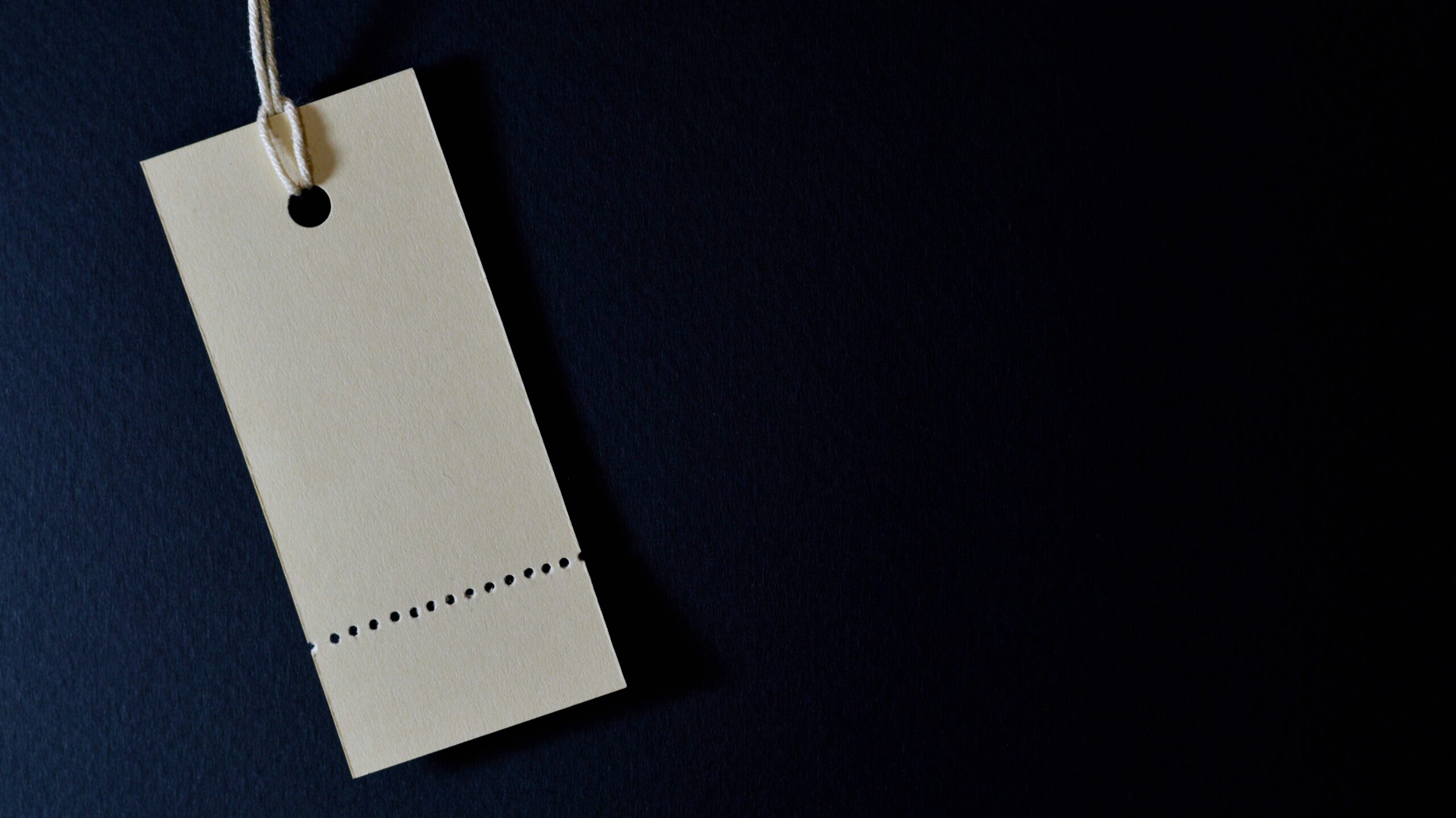 empty price tag on midnight blue background