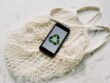 https://www.pexels.com/photo/mobile-phone-with-green-recycling-sign-and-mesh-bag-3850512/