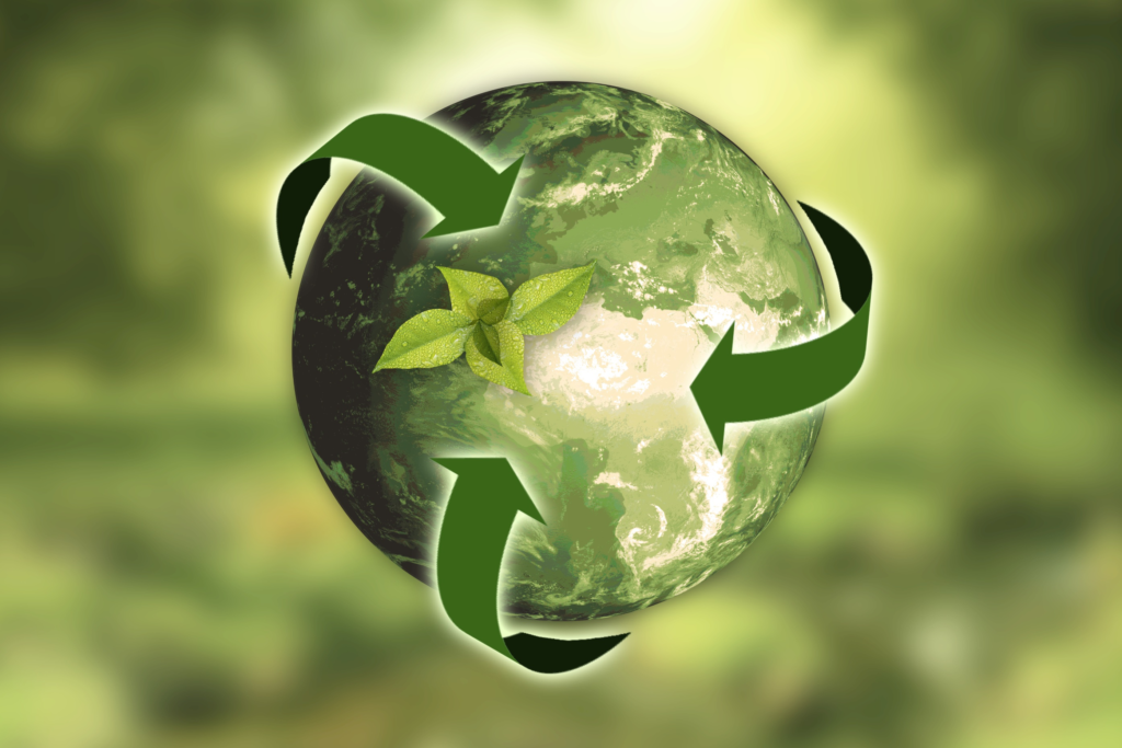 Green earth with a plant growing