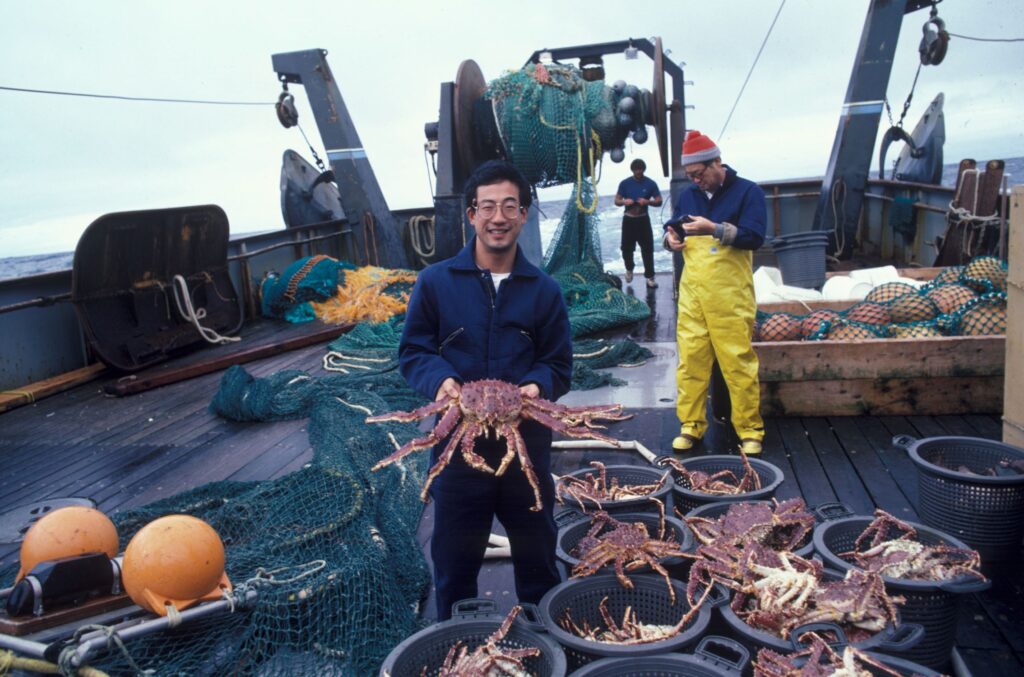man fishing large amount of fish 