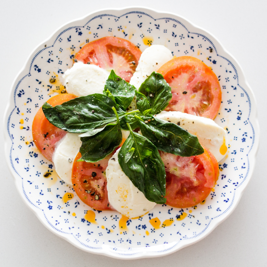mozzarella cheese with sliced tomatoes and basil for vegetarian