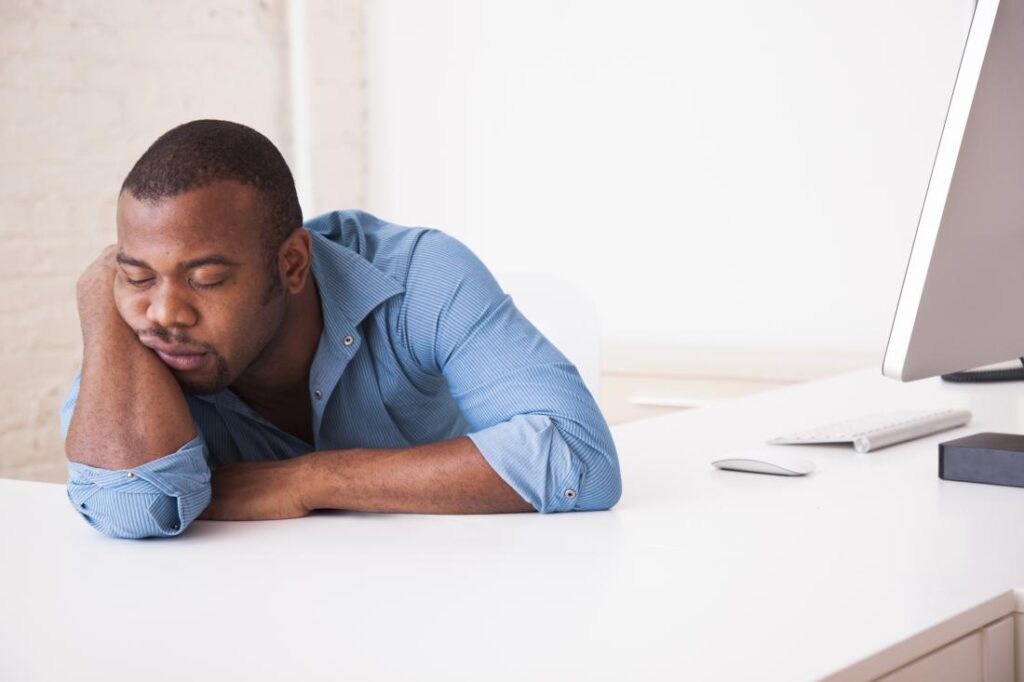 Man in his office sleeping at work.