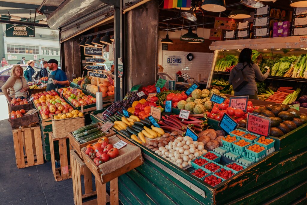 people shopping at a farmer's market