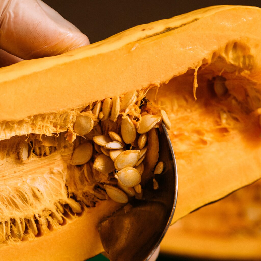 scooping the seeds out of a spaghetti squash