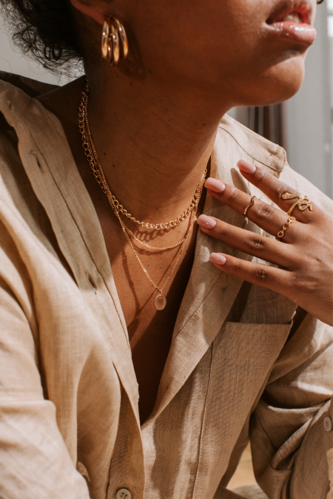 stackable jewelry outfit inspiration featuring necklaces, rings, and earrings