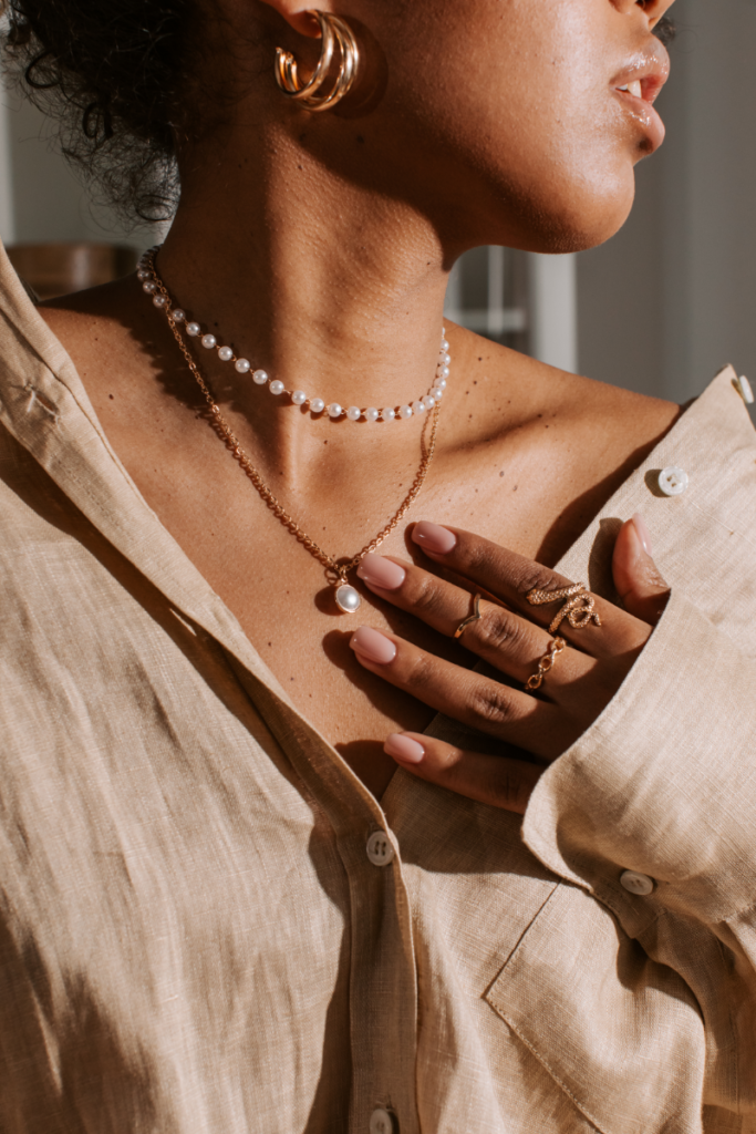 stackable jewelry outfit inspiration featuring necklaces, rings, and earrings