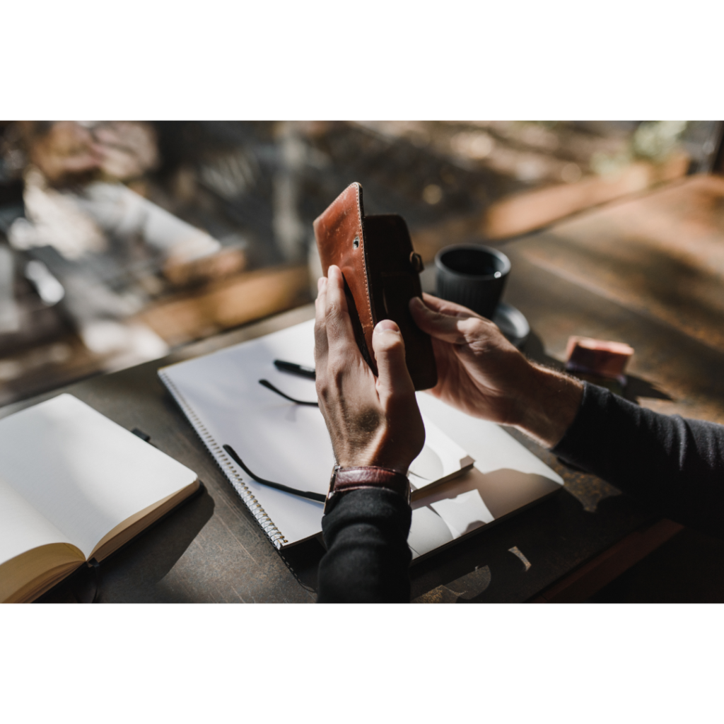 man holding open wallet