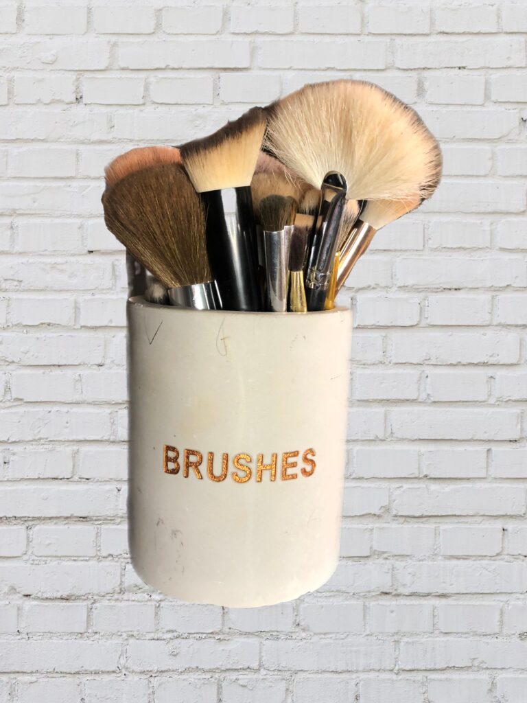Cup of makeup brushes. 