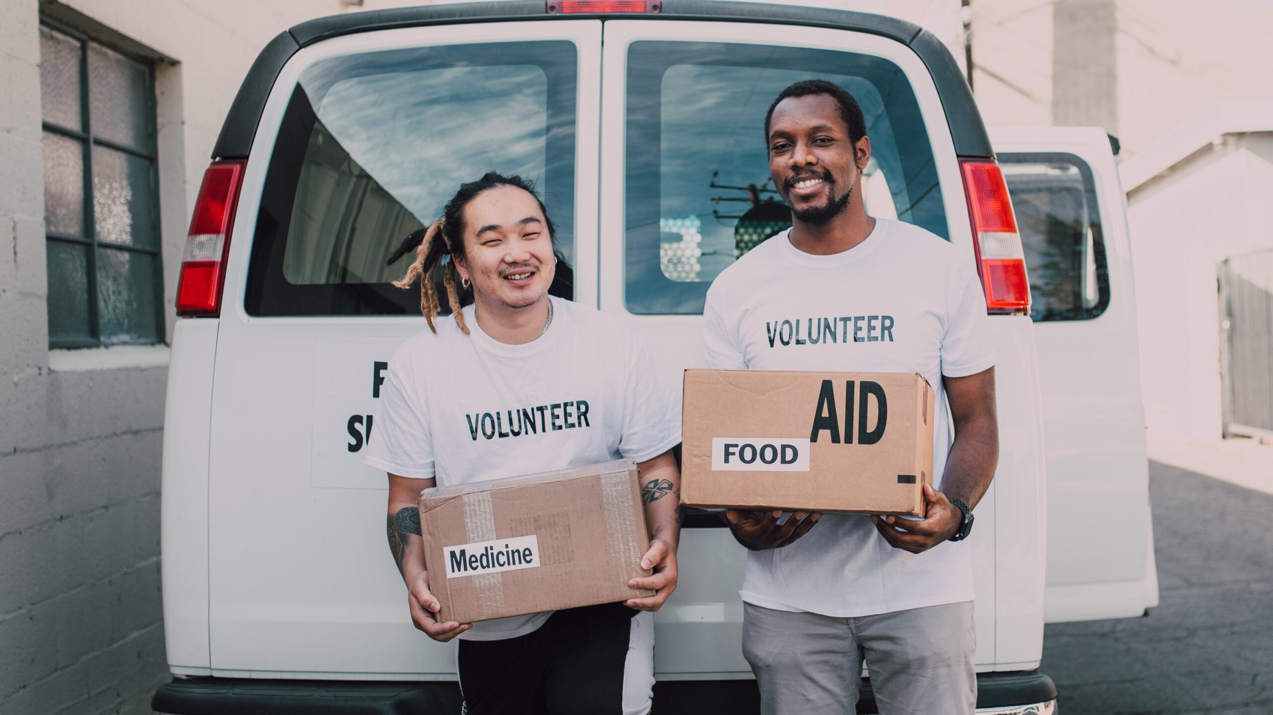 volunteers prepare to deliver meal kits and food boxes, as well as medicine, to families in need