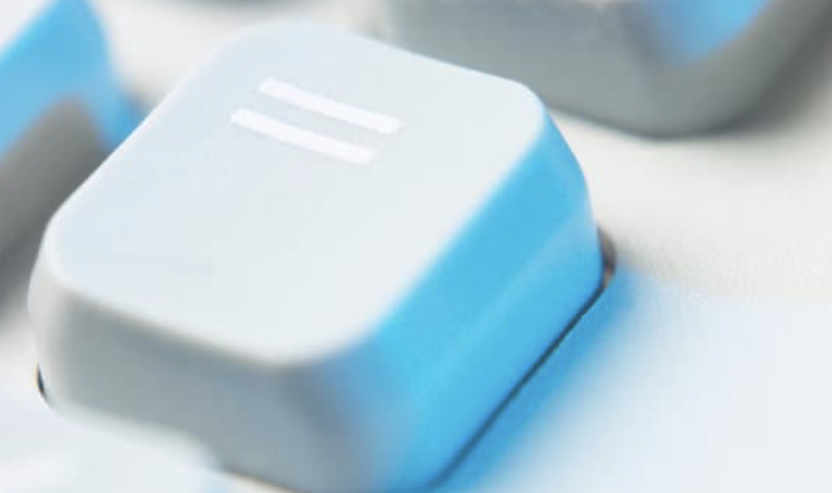 A blue equal sign keyboard piece zoomed in closely