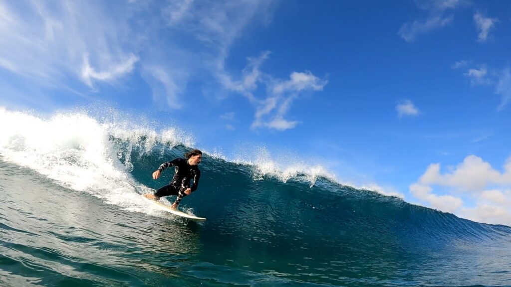 Regularfoot surfer surfing in Canary Islands (Atlantic Ocean)