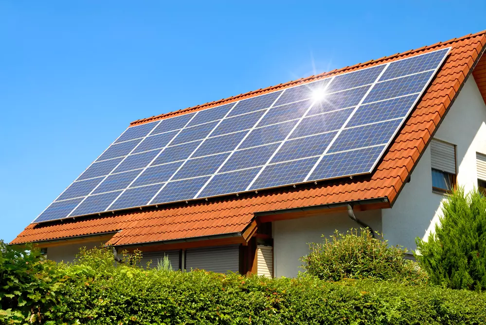 Solar panels installed on a rooftop, capturing sunlight to produce renewable energy.