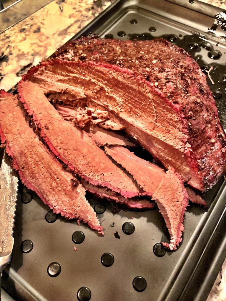 sliced brisket after being made on the grill