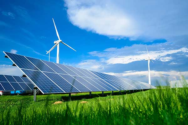 Wind turbines generating clean energy under a bright blue sky