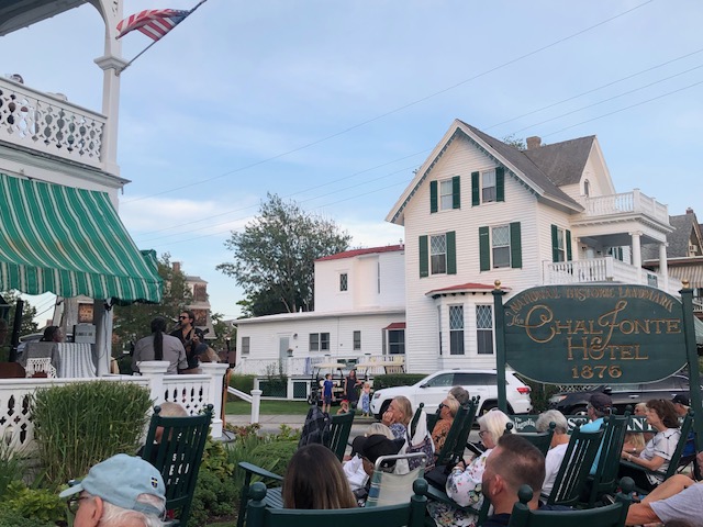 Outdoor seating in front of the Chalfonte Hotel while The Howard Street Ramble Band prepare to play music in Cape May