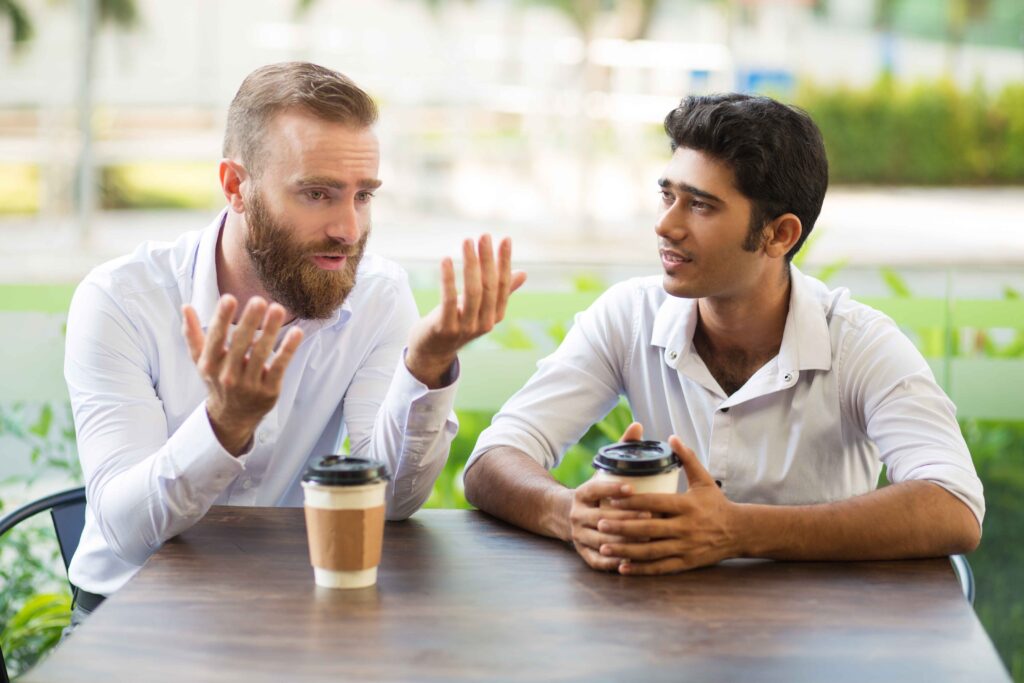 men gossiping about partners