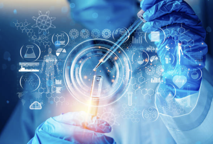 Medical research being performed by a doctor with a dropper and test tube.