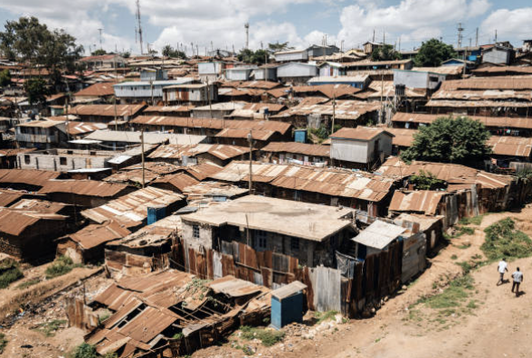 A photograph of shacks in an impoverished community.